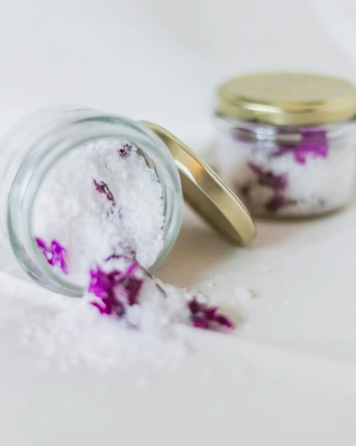 Jars of bath salts with flower petals
