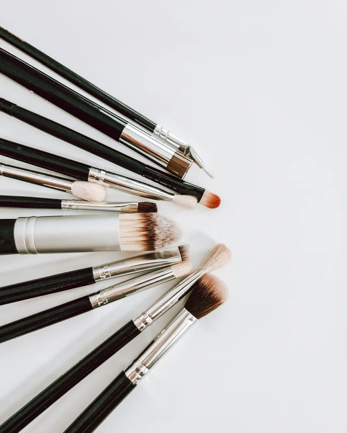 Makeup brushes on a white background