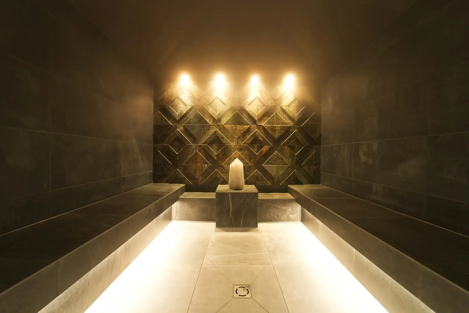 A lit stone steam room