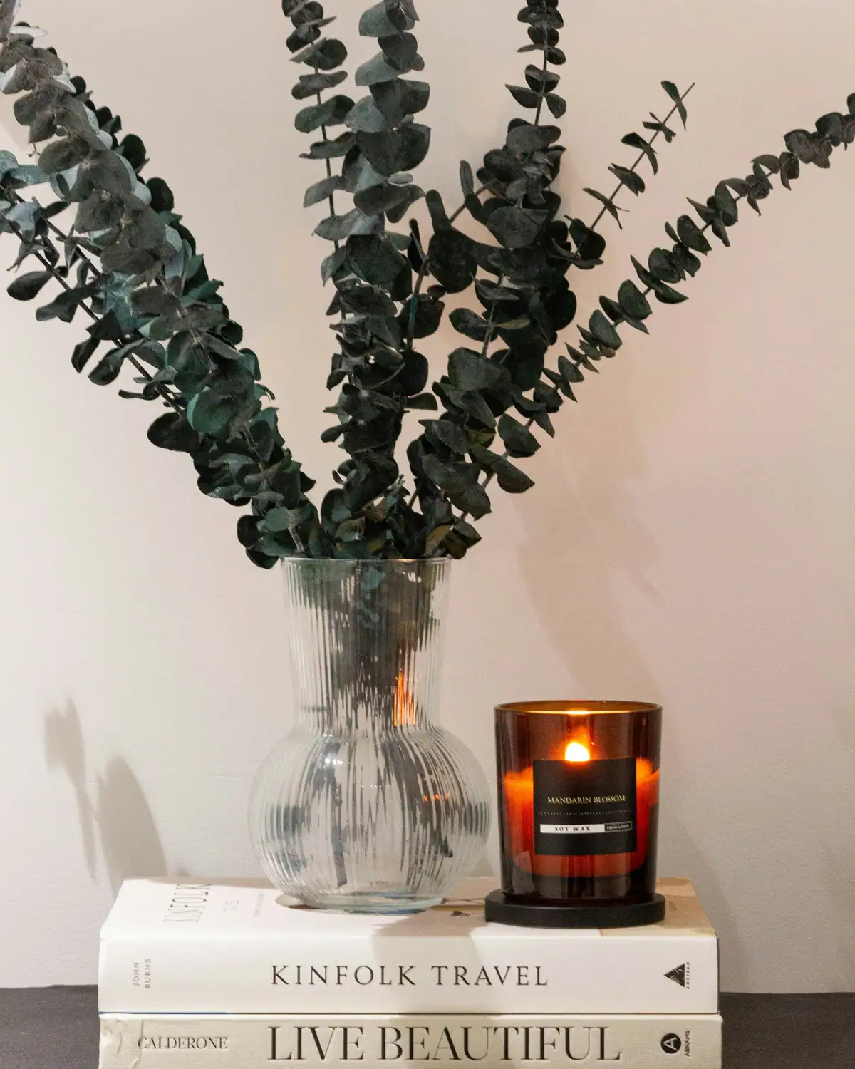 Eucalyptus, a candle and books