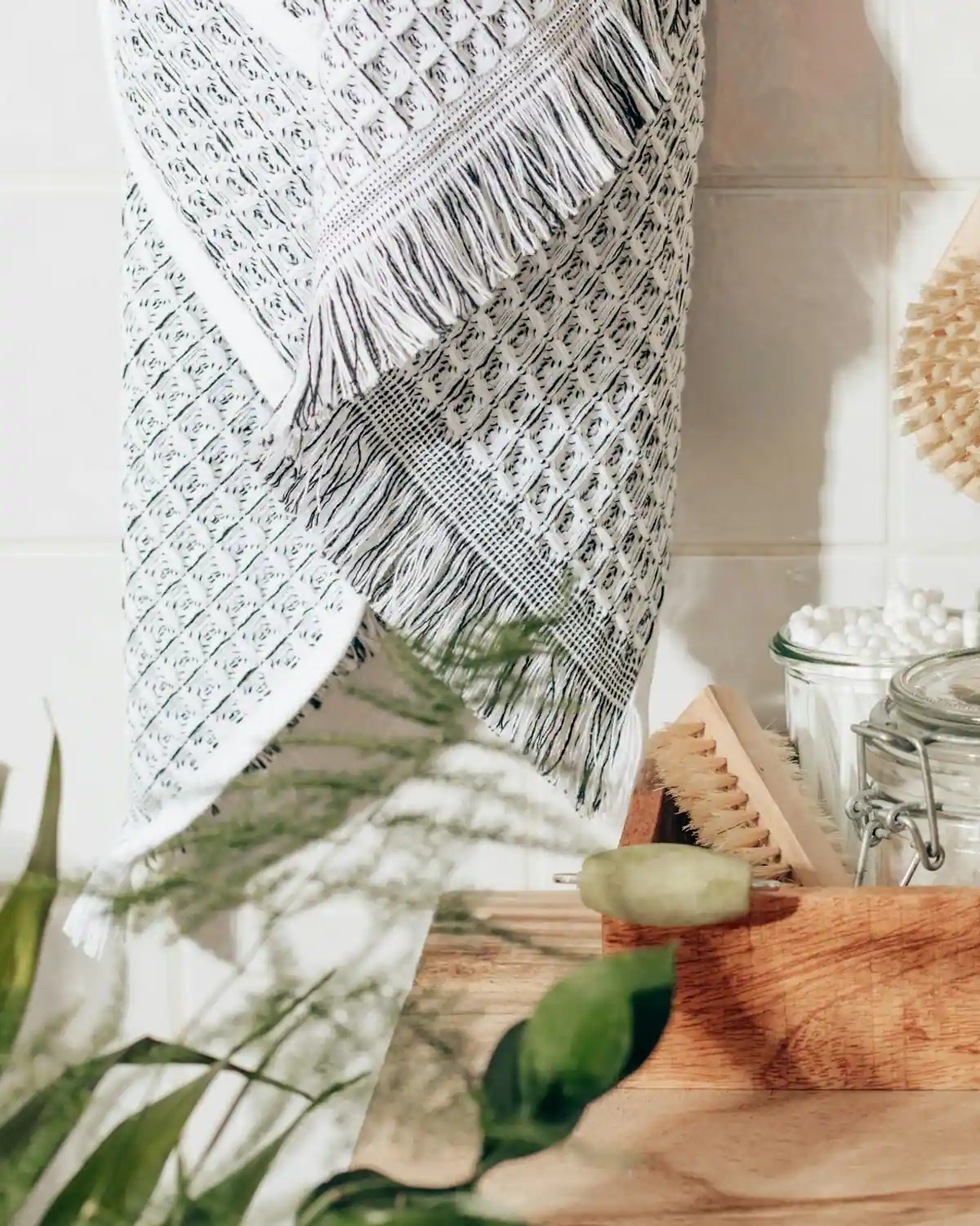 A towel, natural brushes and care jars